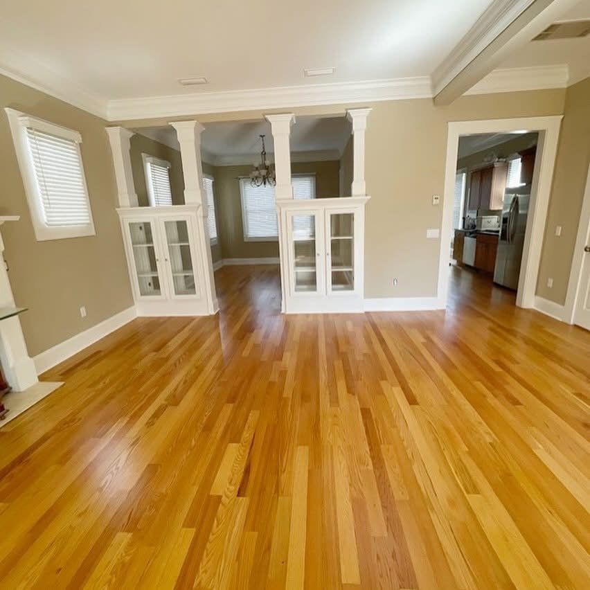Living room with hardwood floors, neutral walls and French doors