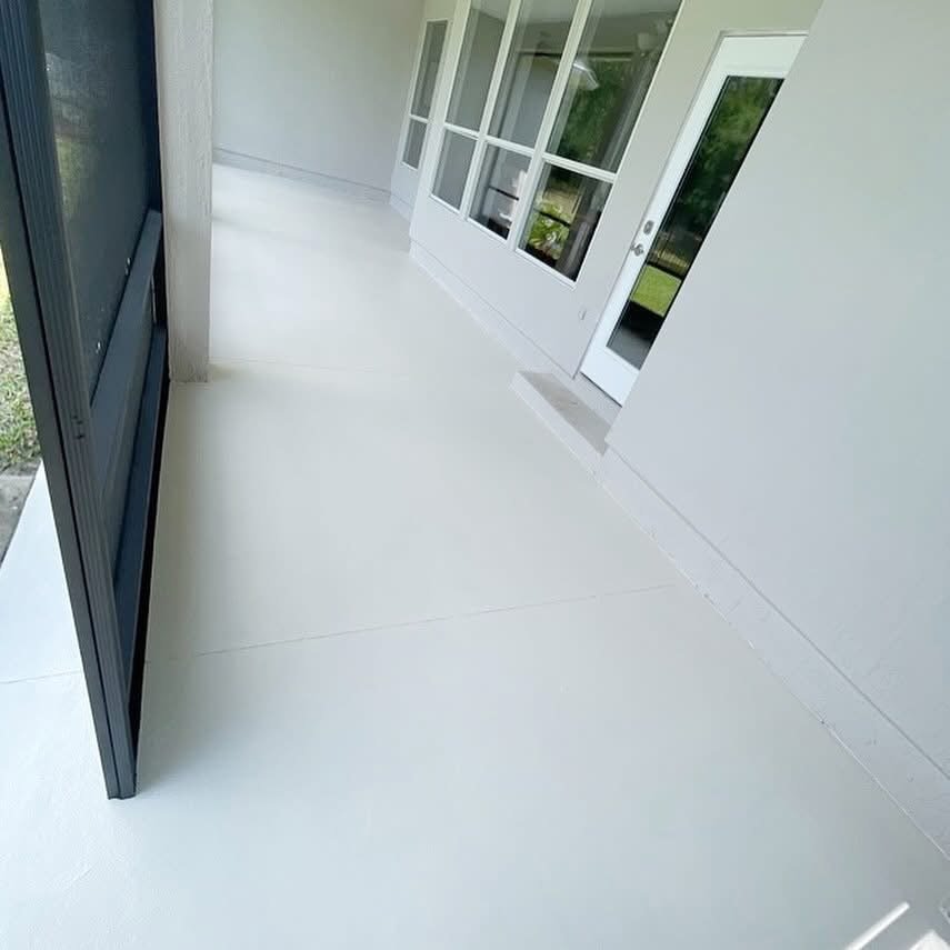 Bright white living room after interior painting and flooring installation