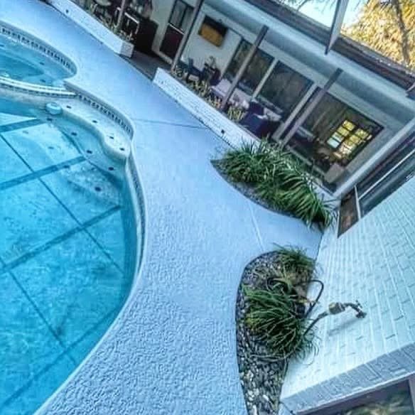Screened pool enclosure and paver deck at a Ponte Vedra Beach home