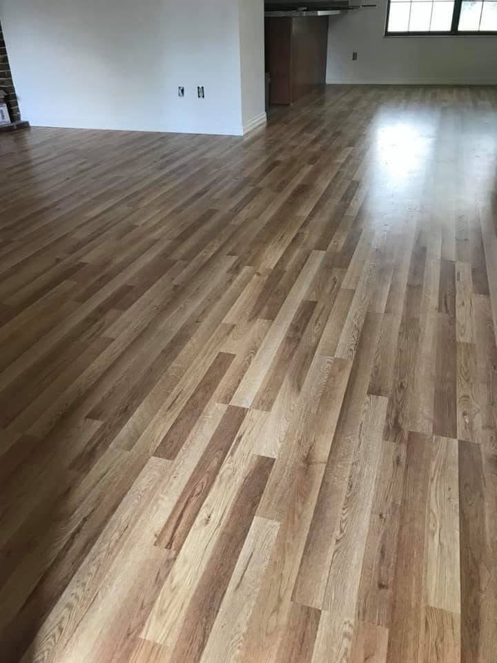 Wide-plank wood-look flooring installed in an open living area