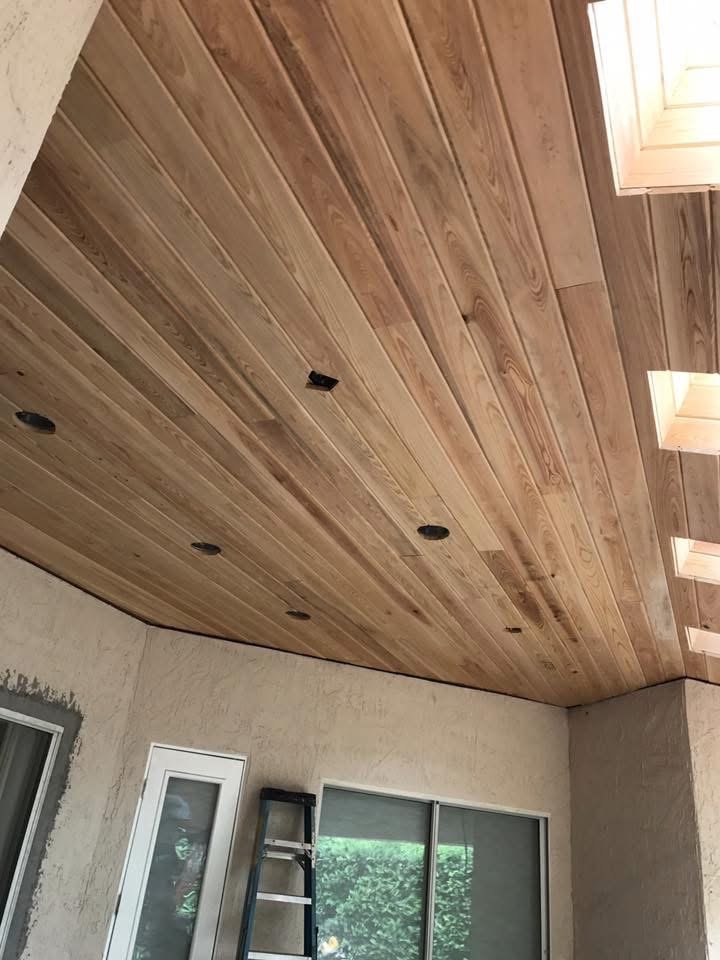 Wood plank ceiling installation with skylights in a St. Johns, FL home